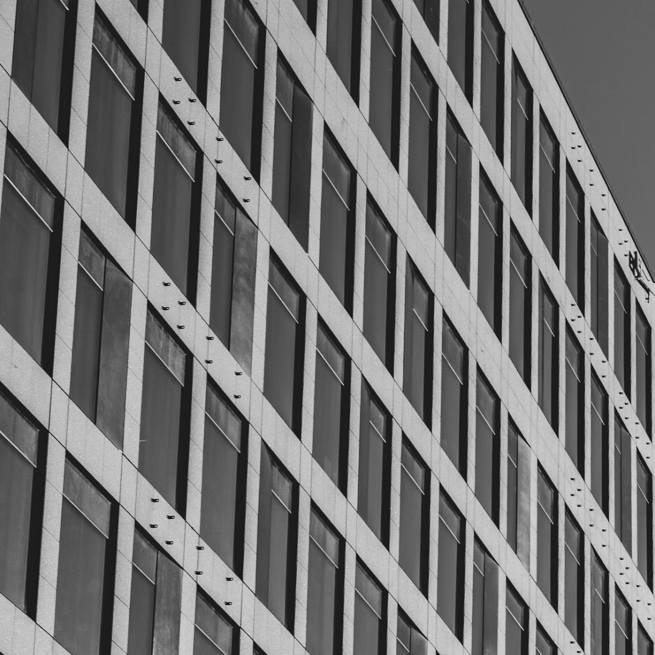 Monochrome modern facade grid viewed on a diagonal